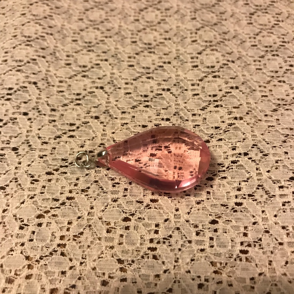 Rose colored clear pendant on silver hardware